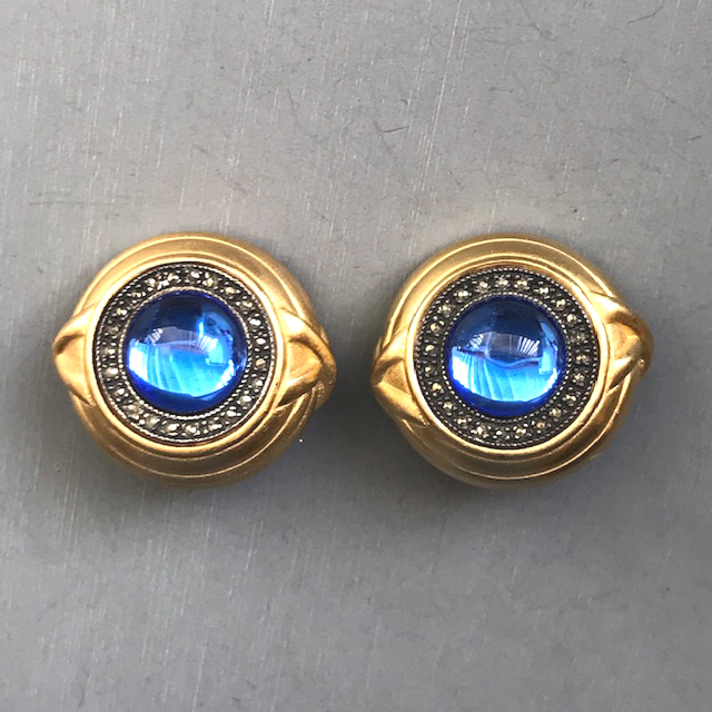 JUDITH JACK blue glass cabochon earrings with a halo of tiny marcasites in a gold plated sterling silver setting