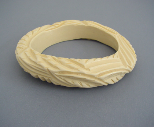 LES BERNARD unsigned cream carved plastic bangle