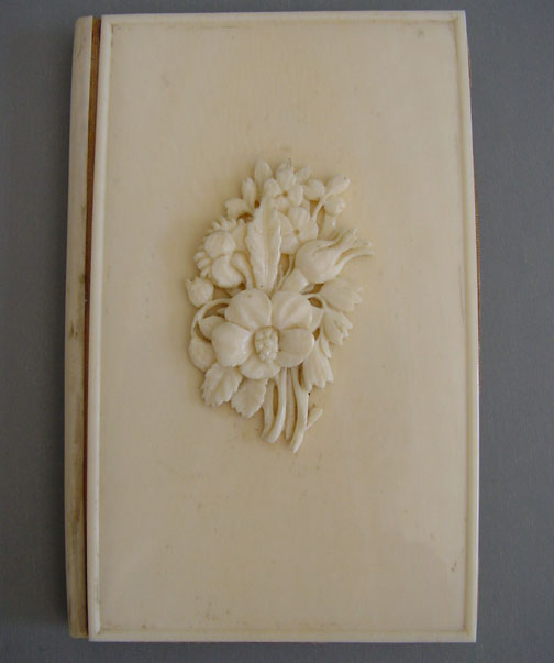 VICTORIAN French pocket book with carved flower bouquet