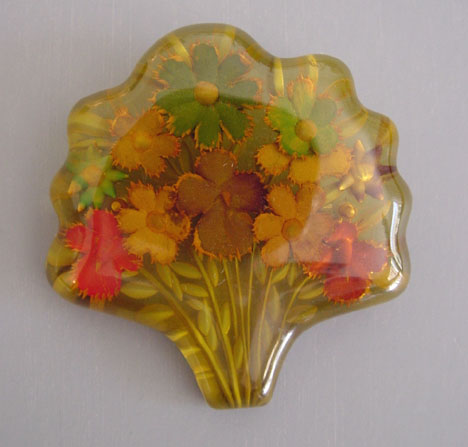 BAKELITE apple juice reverse carved bouquet brooch