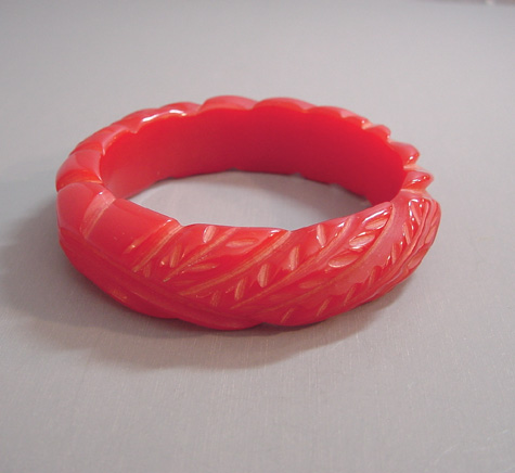 BAKELITE red pineapple carved bangle