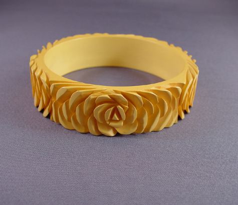 BAKELITE butterscotch deeply carved bangle, roses