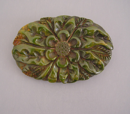 BAKELITE green with yellow swirl oval flower brooch