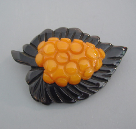 BAKELITE butterscotch and black leaf and grapes brooch