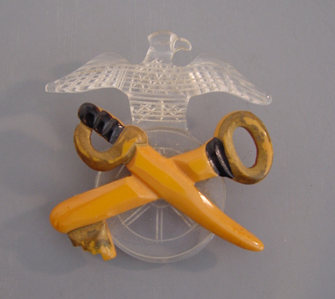 BAKELITE butterscotch and Lucite carved military theme brooch