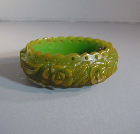 BAKELITE hinged clamper, a translucent green roses and leaves carved