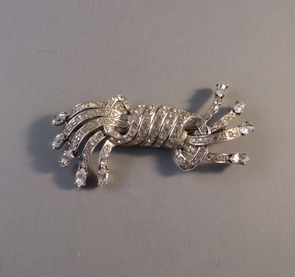 EISENBERG sterling and clear rhinestones swirl brooch, 1946
