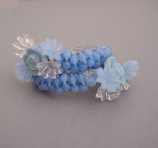 MIRIAM HASKELL Hess baby blue coil bracelet with flowers