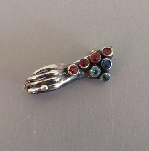 HOBE silver hand pin with red, blue and pastel blue rhinestones