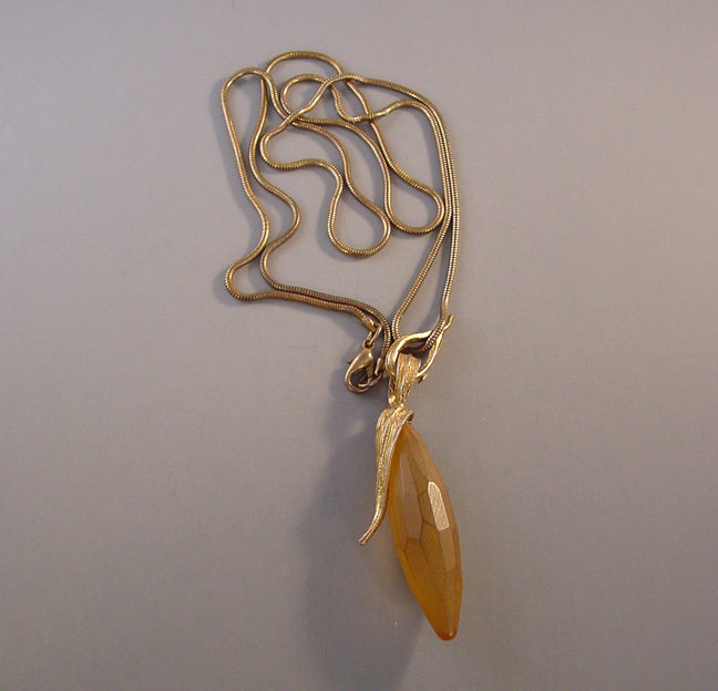 LUCITE pendant necklace with carved golden drop