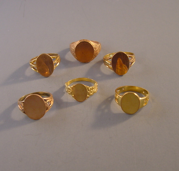 BRASS salesman’s sample signet rings c 1910, group of 6