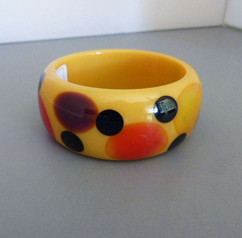 SHULTZ bakelite muted buttery-colored bangle, swirl dots