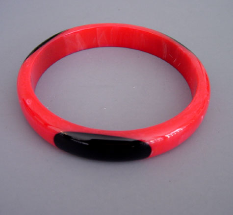 SHULTZ bakelite red spacer bangle with four black dots