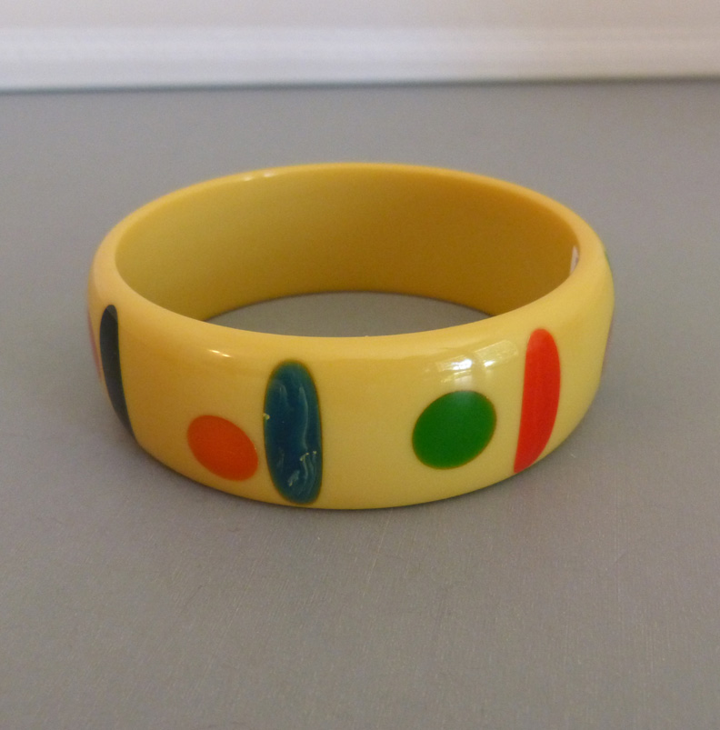 SHULTZ bakelite soft yellow bangle with colorful dots