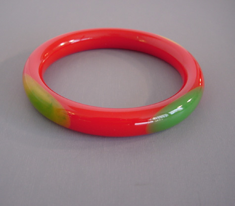 SHULTZ bakelite red tube bangle with peach, yellow green dots