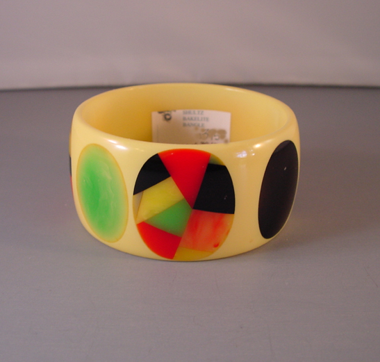 SHULTZ bakelite creamy yellow bangle with striped dots