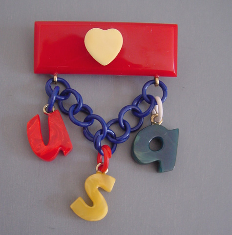 SHULTZ bakelite patriotic brooch “USA”