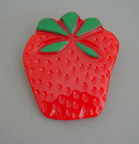 SHULTZ bakelite red strawberry brooch with green painted leaves
