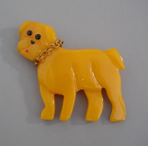 SHULTZ bakelite yellow carved dog brooch