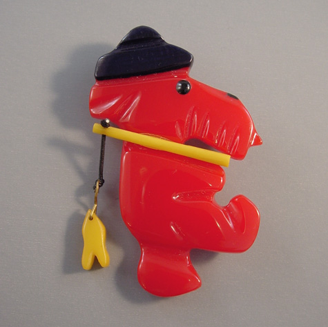 SHULTZ bakelite red walking fisherman dog brooch