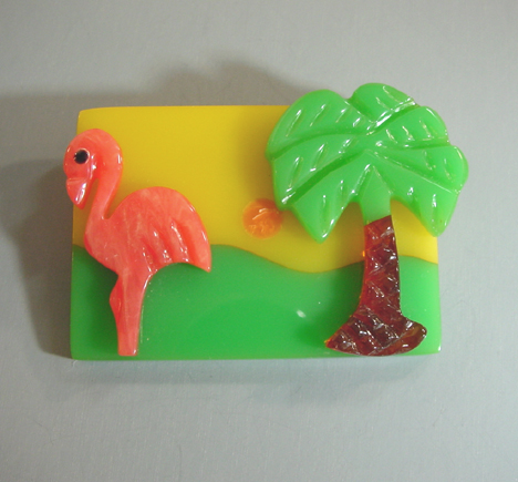 SHULTZ bakelite Sun Over Miami brooch with sunset flamingo