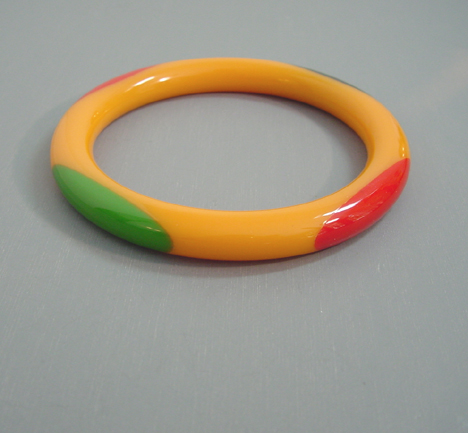 SHULTZ bakelite orange tube bangle red black green dots