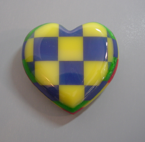 SHULTZ bakelite heart brooch with four laminated layers