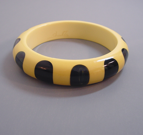 SHULTZ bakelite cream bangle with blue & black dots