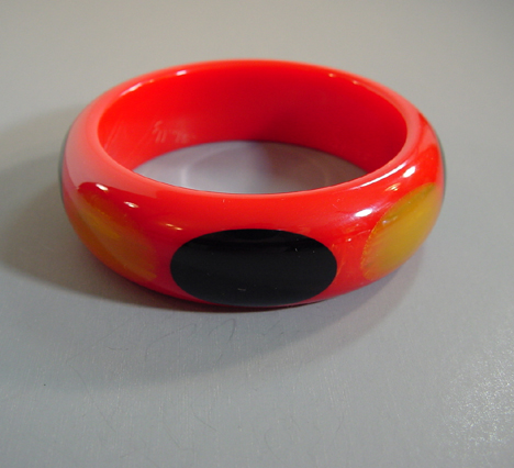 SHULTZ bakelite red bangle with oval dots
