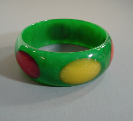 SHULTZ bakelite green bangle with red, orange