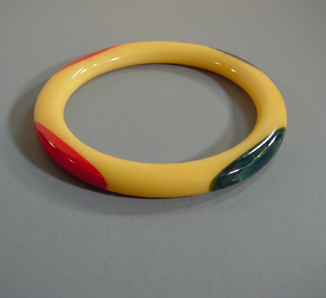 SHULTZ bakelite yellow tube bangle 2 red 2 blue dots