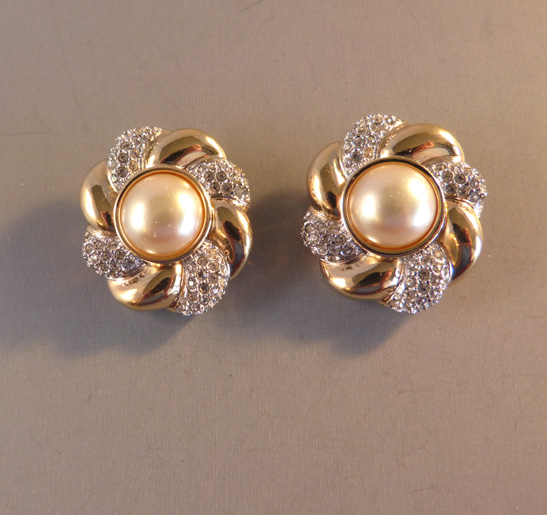 SWAROVSKI swirl earrings with a glass pearl center
