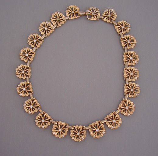TRIFARI gold tone flowers necklace with clear rhinestones