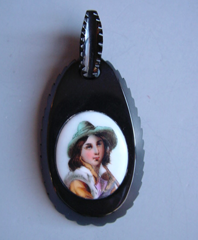 VICTORIAN jet pendant with a hand painted Tyrolean boy