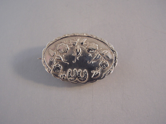 VICTORIAN sterling sweetheart pin with entwined horseshoes, 1900