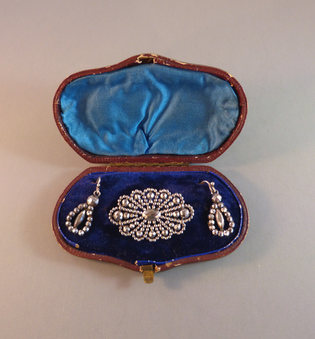 VICTORIAN cut steel brooch and earrings set in a fitted box