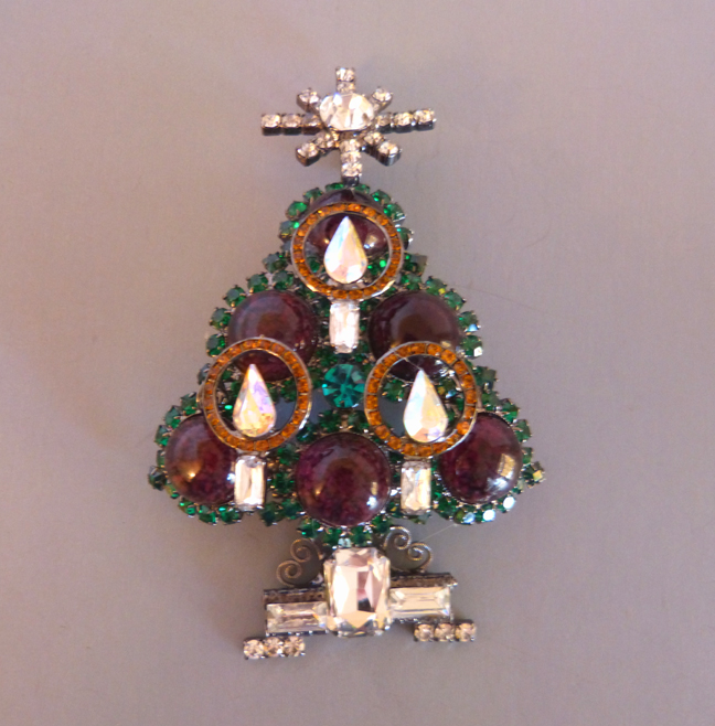 VRBA Christmas tree brooch with high dome ruby colored cabochon
