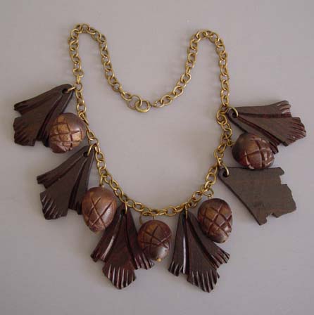 WOODEN carved oak leaves and acorns necklace, or are they pink needles and pine cones