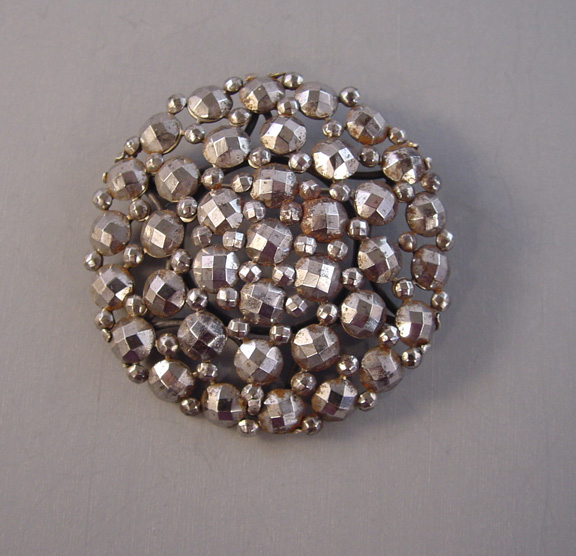 VICTORIAN cut steel round brooch with about 12 facets on each