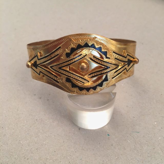 VICTORIAN black enamel on gold tone bracelet with an applied design