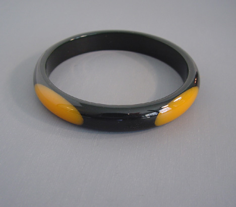 SHULTZ bakelite black spacer bangle with four golden oval dots