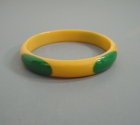 SHULTZ bakelite yellow spacer bangle with green oval dots
