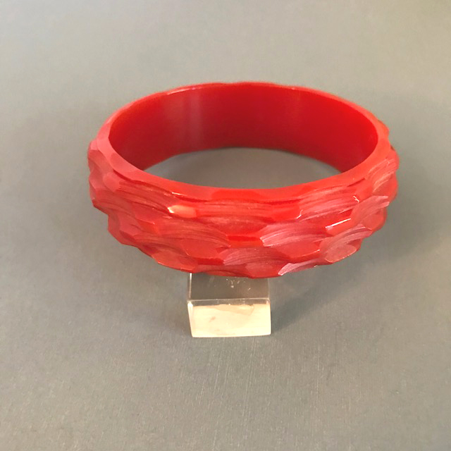 BAKELITE red heavy carved basket weave pattern bangle with great texture