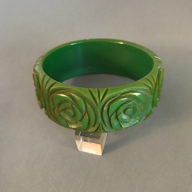 BAKELITE green bangle with open cabbage roses carved all the way around