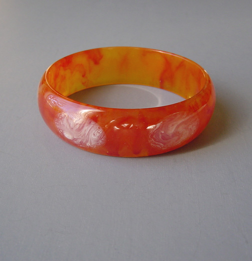 SHULTZ bakelite caramel swirl bangles with white cloud dots