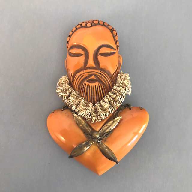 BAKELITE carved nobleman’s face brooch  in butterscotch
