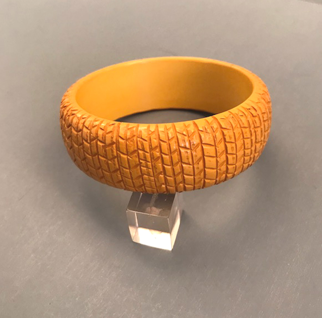 BAKELITE butterscotch bangle with close and intricate herringbone carving