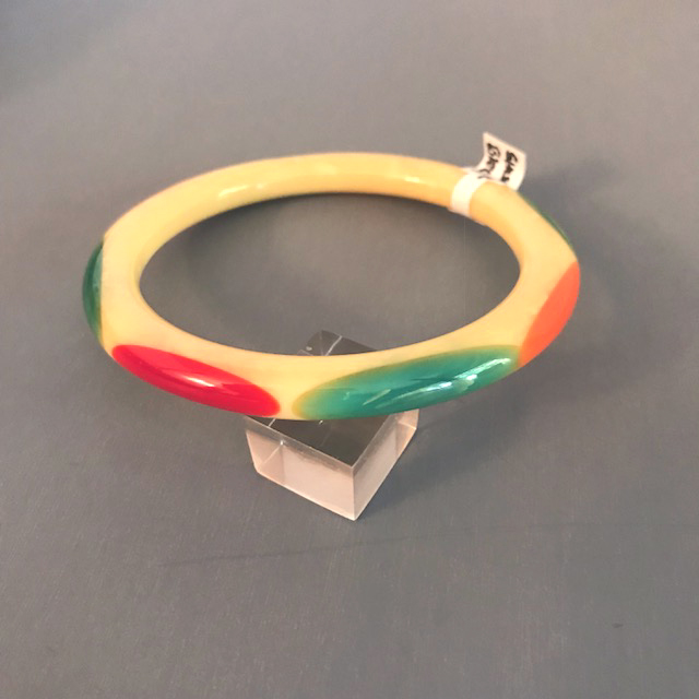 SHULTZ bakelite tube bangle in cream with white marbling and 8 oval dots