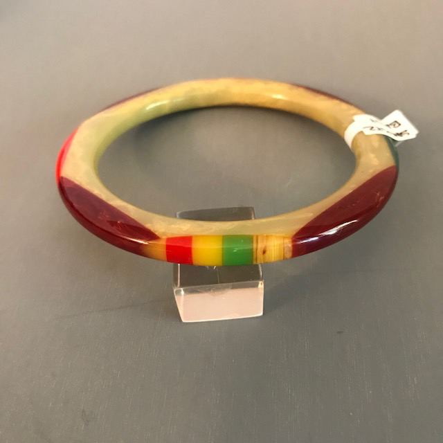 SHULTZ bakelite tube spacer bangle in light green with cream marbling and overlapping oval dots