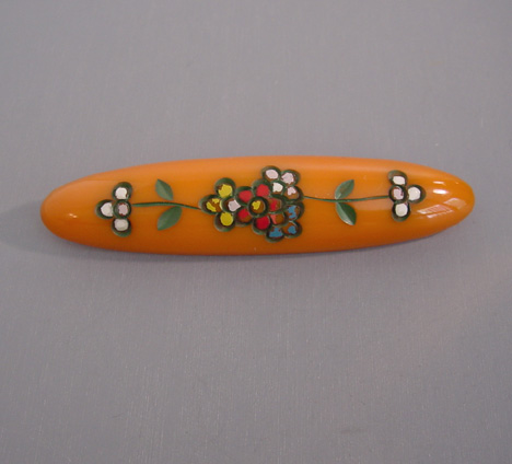 BAKELITE medium butterscotch bar brooch carved & painted flowers